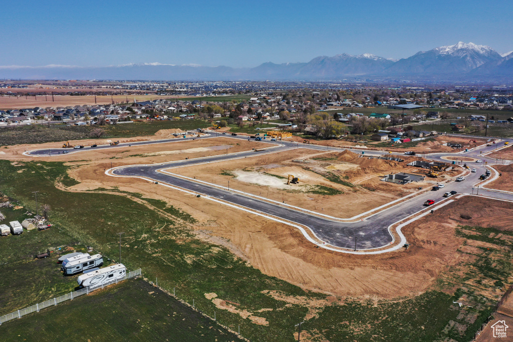 Aerial overview of property's location with a mountainous background