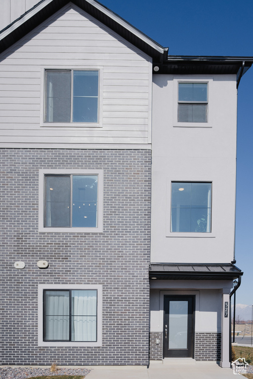 View of front facade with stucco siding