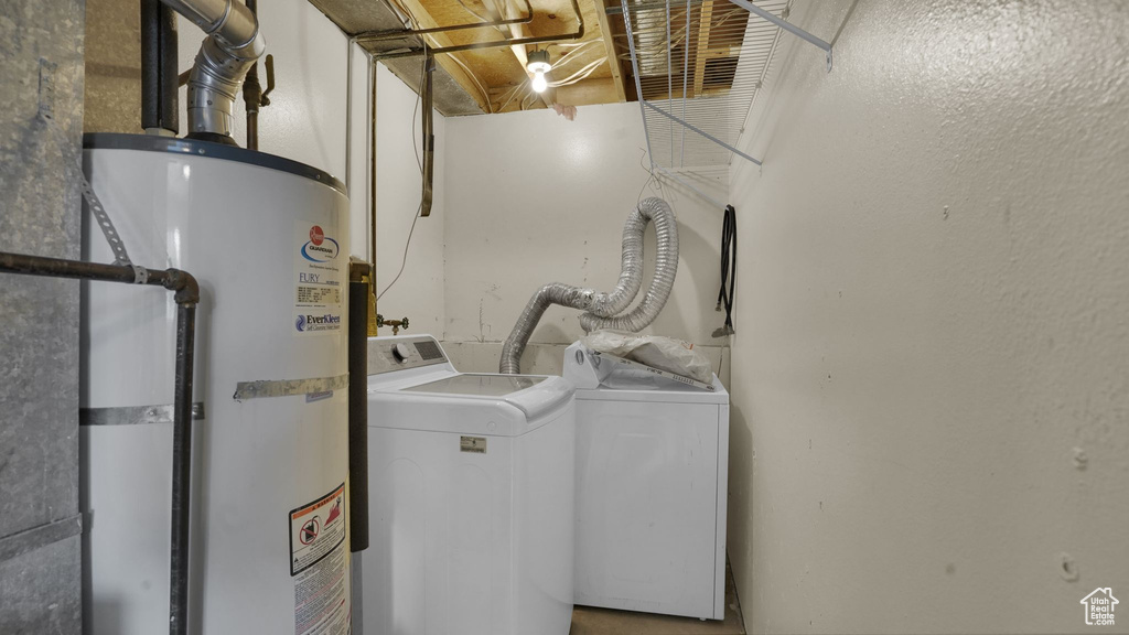 Washroom with gas water heater and washer and dryer