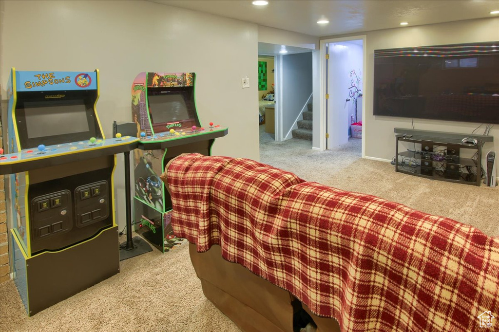 Living room with carpet, stairs, and recessed lighting
