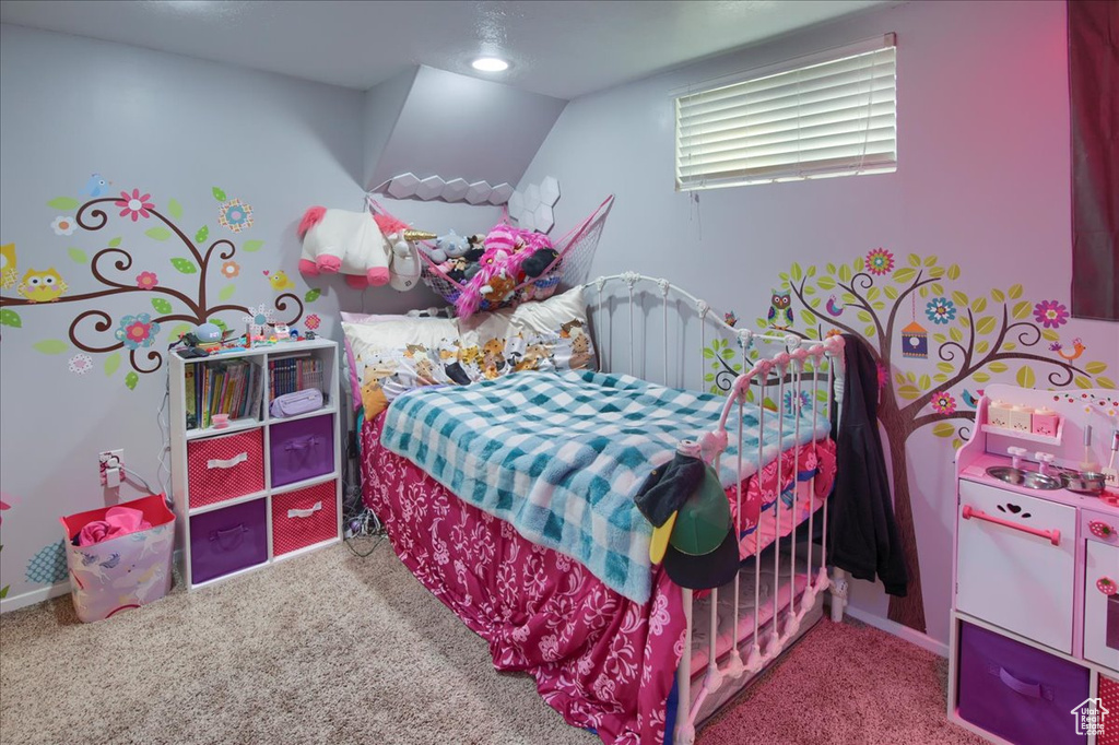 Carpeted bedroom featuring baseboards