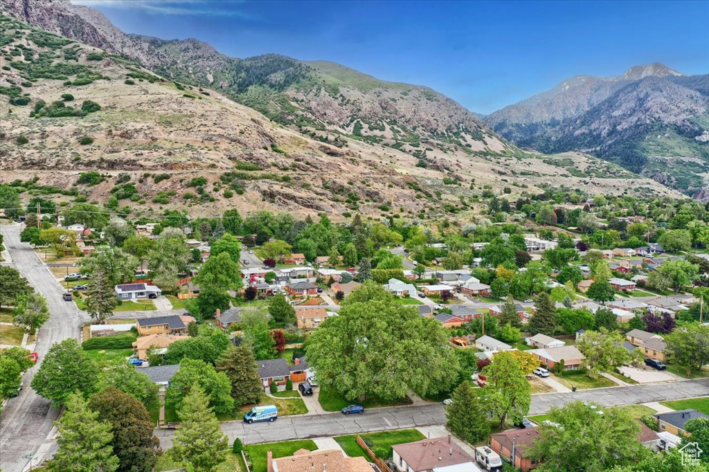 Aerial view of residential area featuring a mountainous background