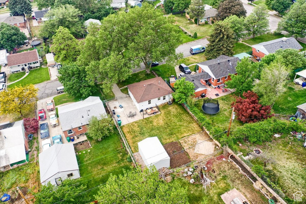 Aerial view of property and surrounding area with nearby suburban area
