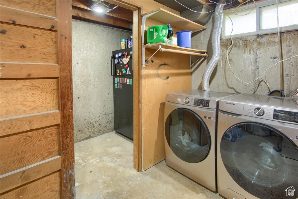 Washroom featuring washing machine and clothes dryer