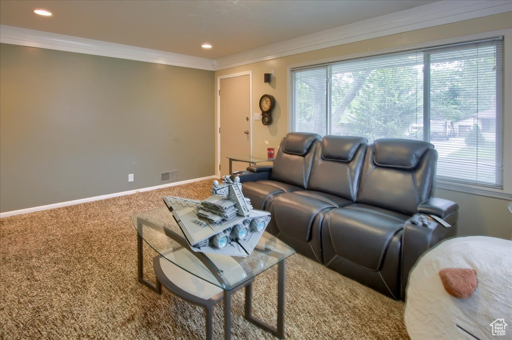Living room with ornamental molding, carpet, baseboards, and recessed lighting