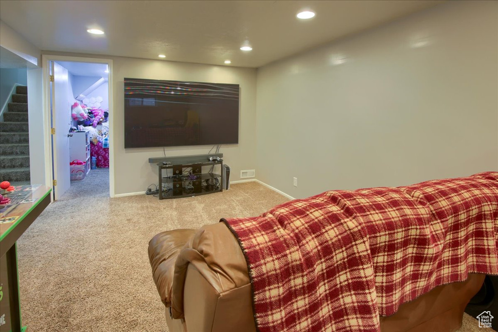 Carpeted home theater featuring recessed lighting and baseboards