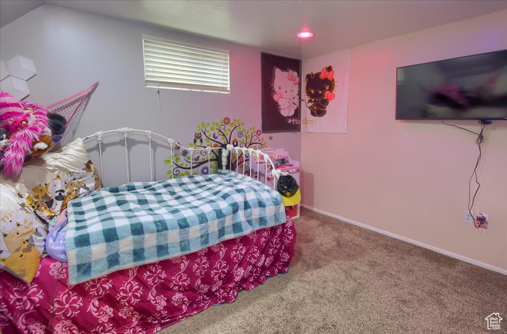 Bedroom with carpet floors and baseboards