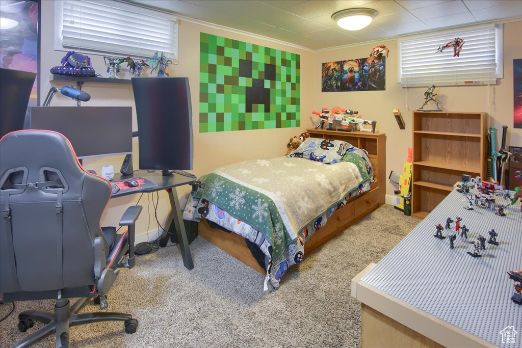 Bedroom featuring carpet flooring, a desk, crown molding, and baseboards