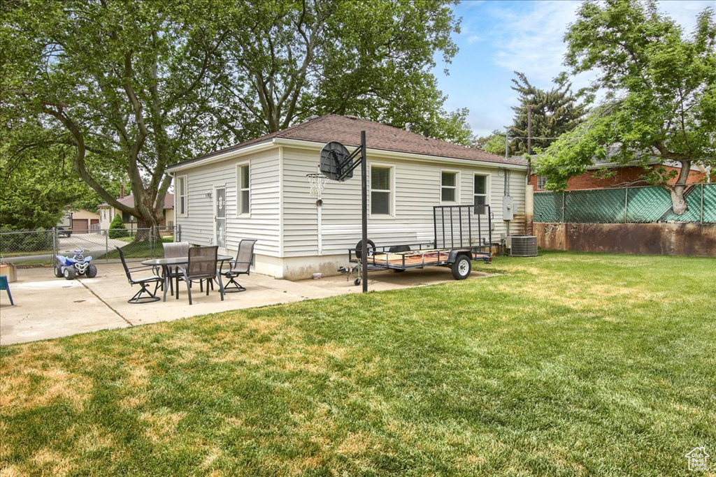 Back of property featuring a patio and central air condition unit