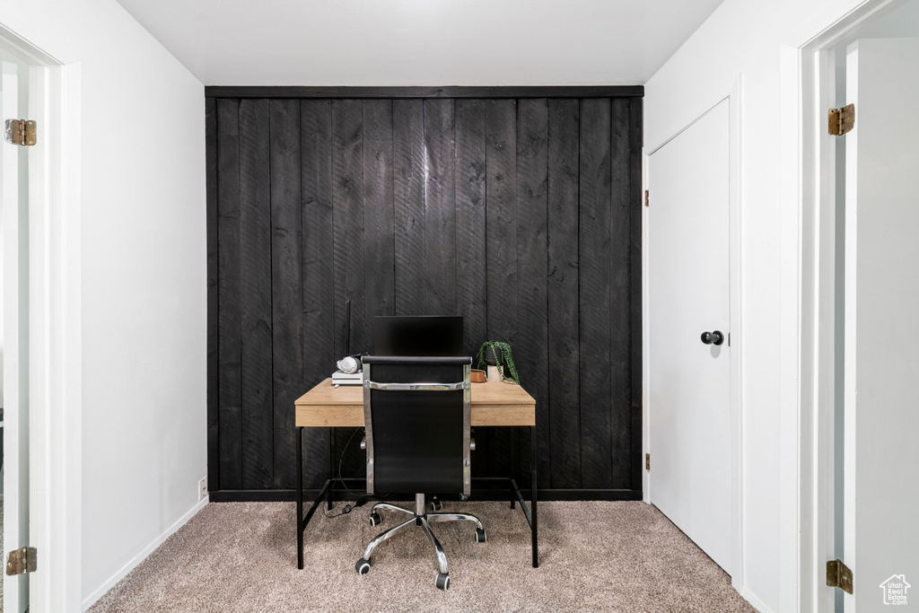 Carpeted office with baseboards