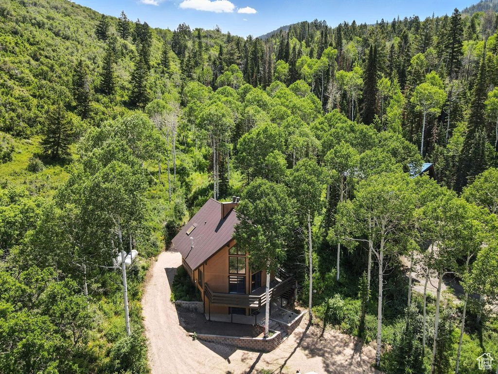 View from above of property with a heavily wooded area