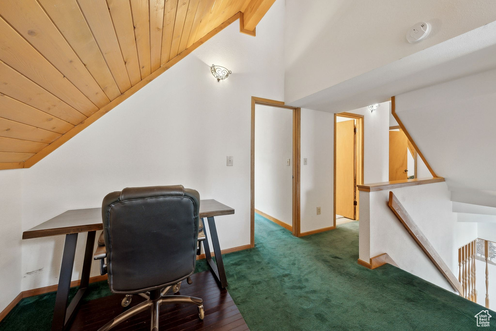 Office featuring vaulted ceiling, wooden ceiling, and baseboards