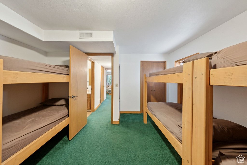 Carpeted bedroom with baseboards