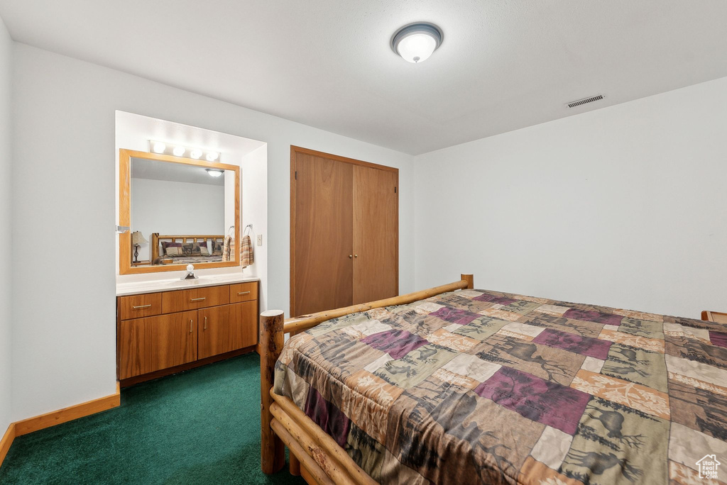 Bedroom with dark colored carpet