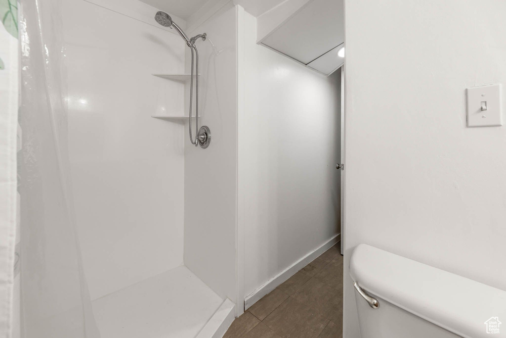 Full bath with a shower and toilet