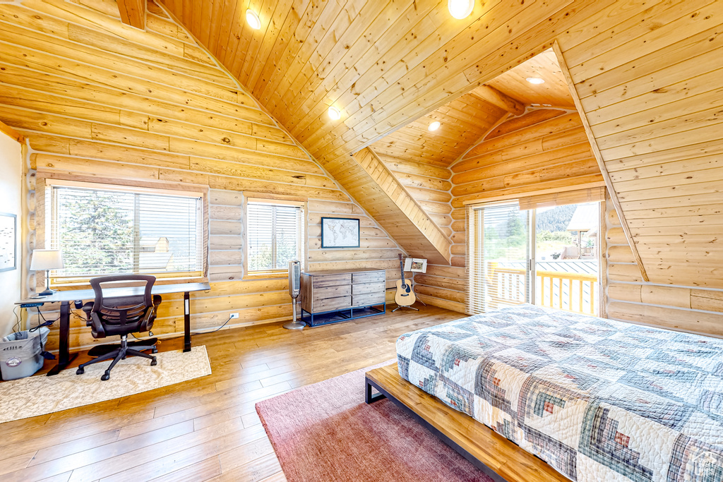 Bedroom with lofted ceiling, rustic walls, wooden ceiling, wood-type flooring, and a desk