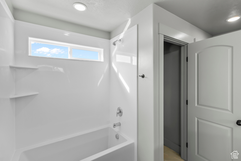Full bath featuring bathing tub / shower combination
