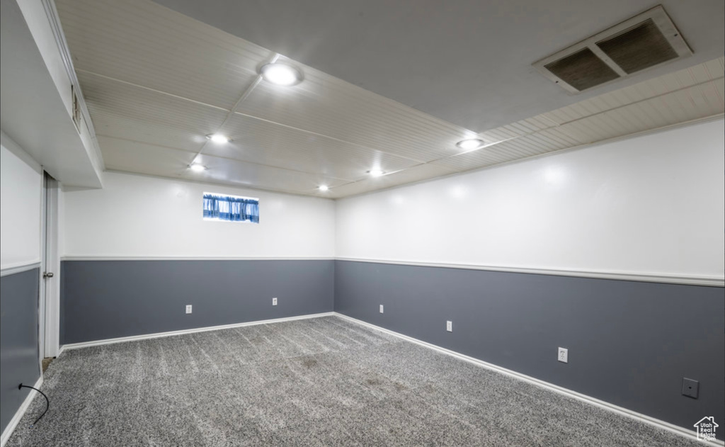 Below grade area with carpet flooring and baseboards