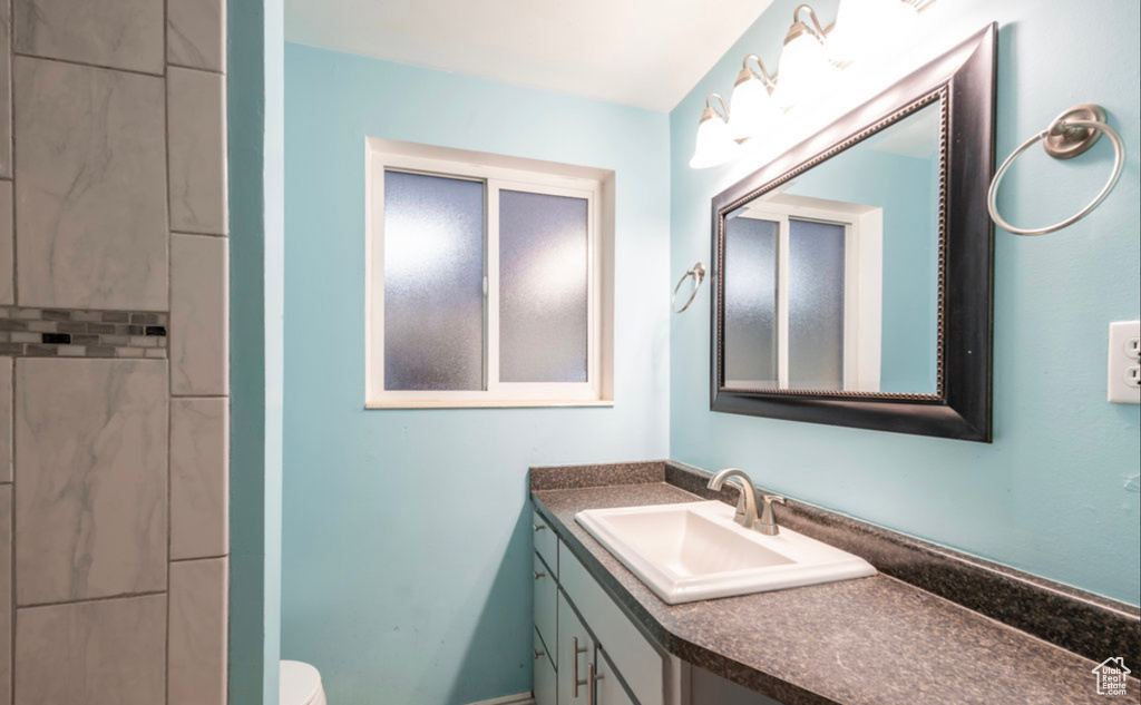 Bathroom with vanity and toilet