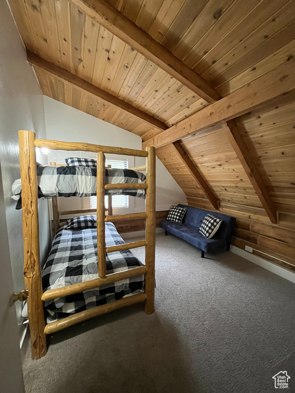 Bedroom with wooden ceiling and carpet floors