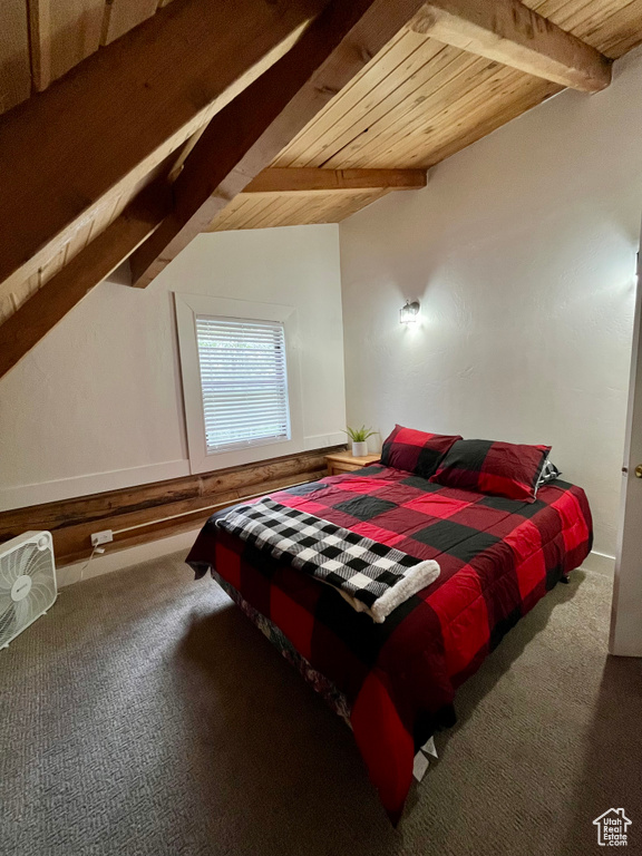 Carpeted bedroom with wood ceiling