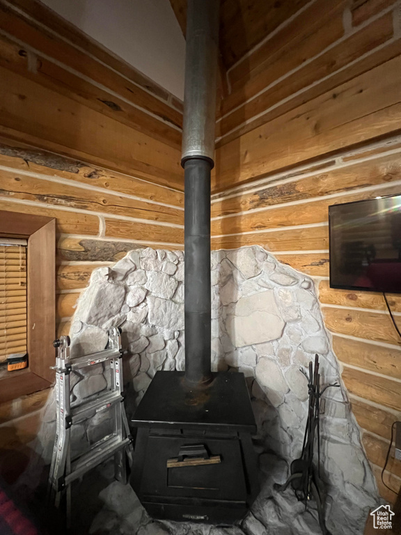 Detailed view of a wood stove and rustic walls