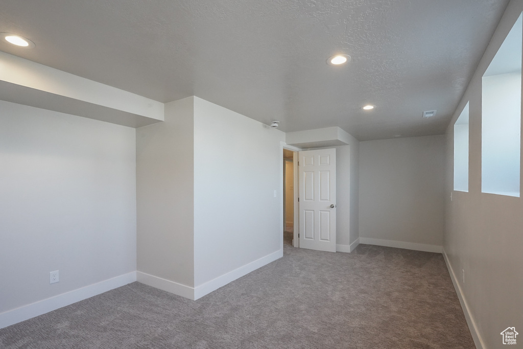 Below grade area with carpet flooring, recessed lighting, and baseboards