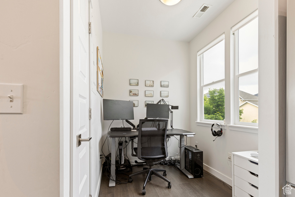 Office space featuring wood finished floors and baseboards