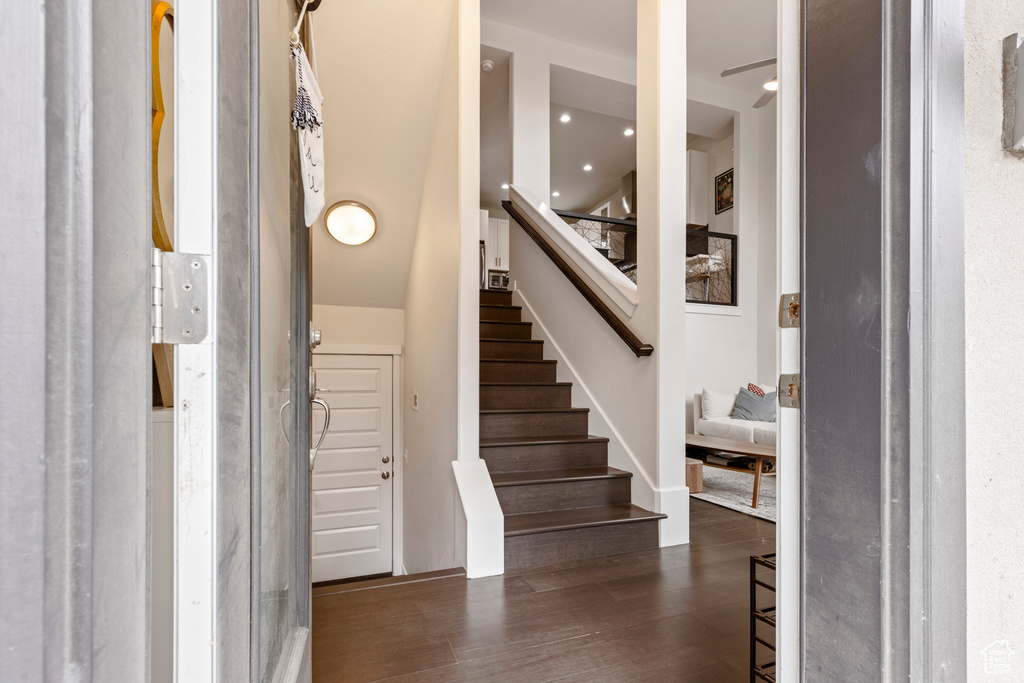 Entrance foyer with stairway and dark wood-style floors
