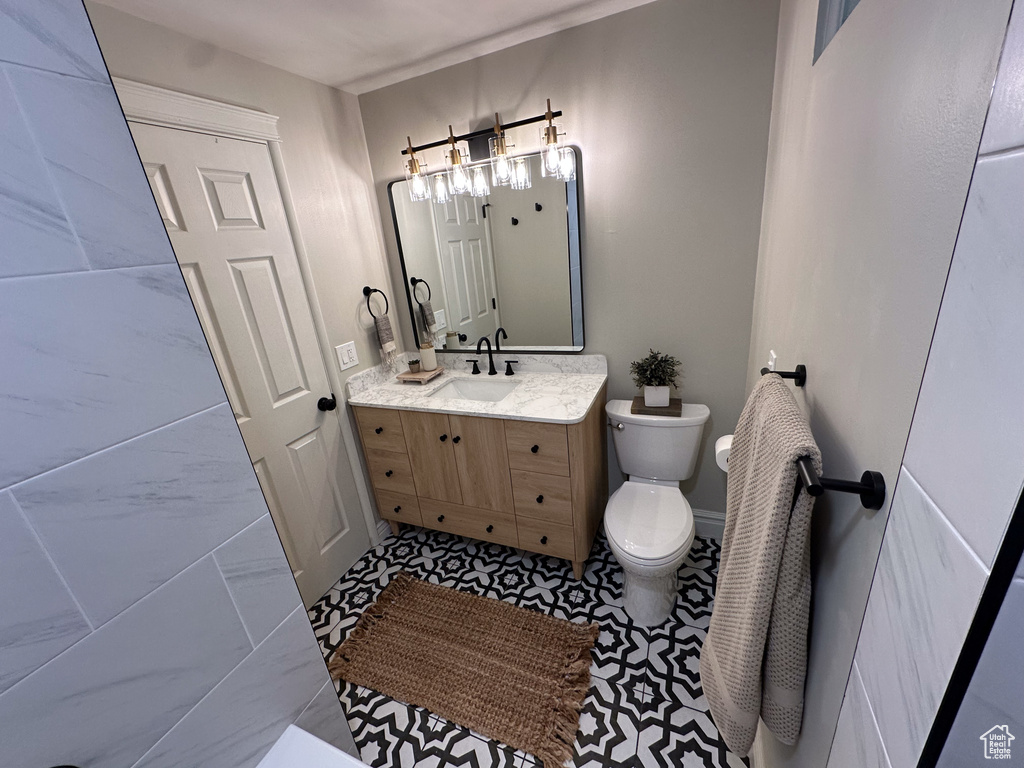 Bathroom with toilet and vanity