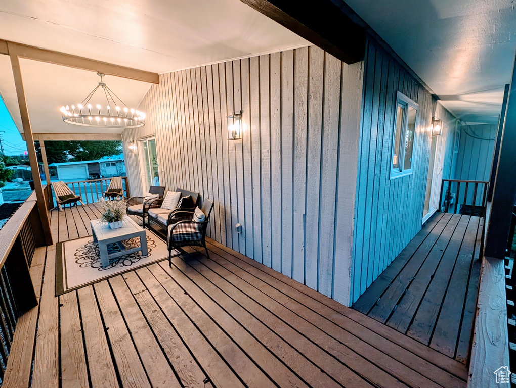 Wooden terrace featuring an outdoor living space
