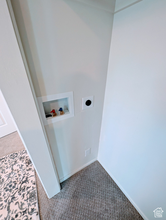 Washroom with carpet floors, electric dryer hookup, hookup for a washing machine, and baseboards