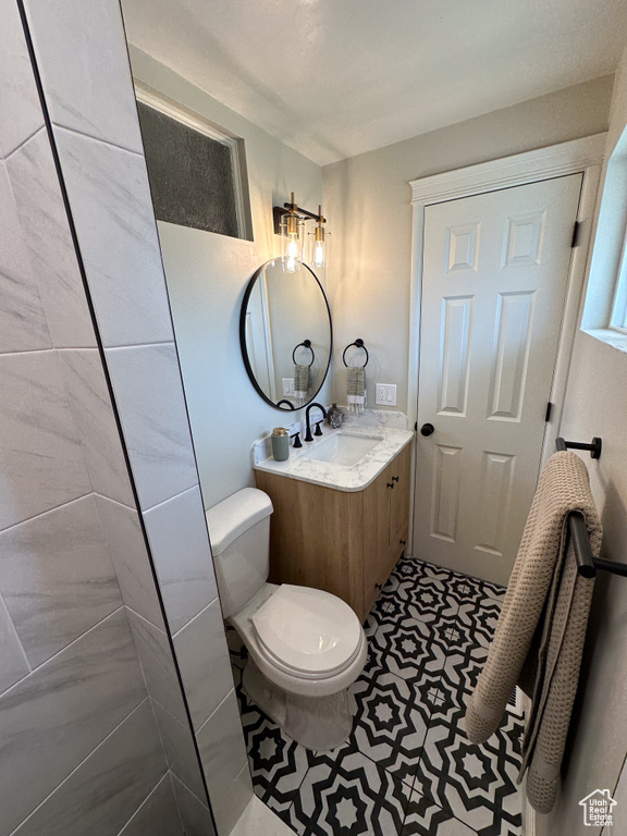 Bathroom featuring vanity and toilet