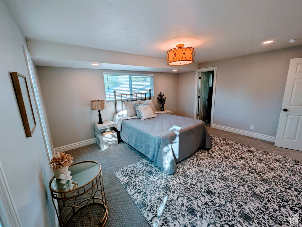 Bedroom with carpet floors, baseboards, and recessed lighting