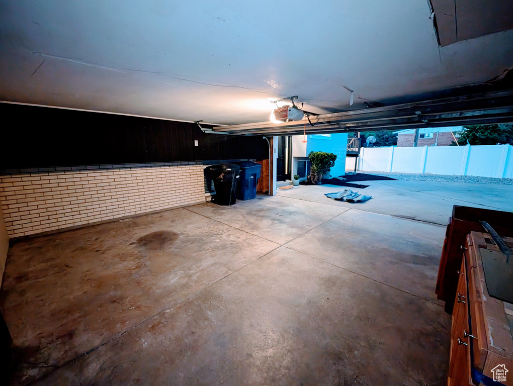Garage featuring a garage door opener