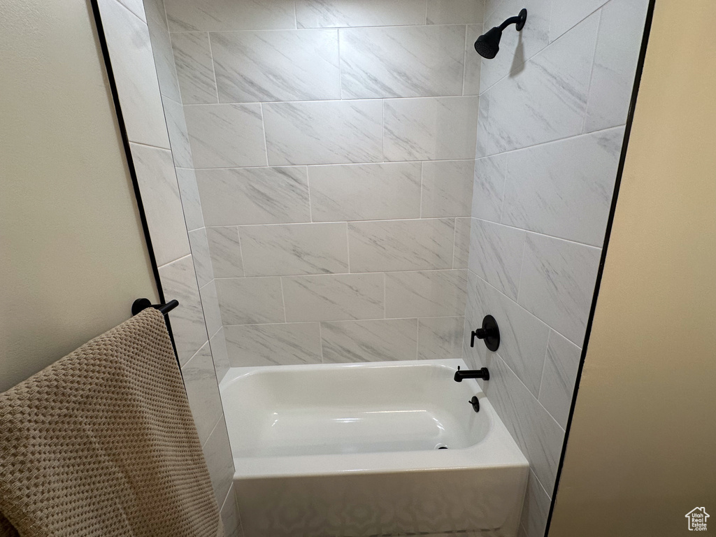 Full bath featuring shower / washtub combination