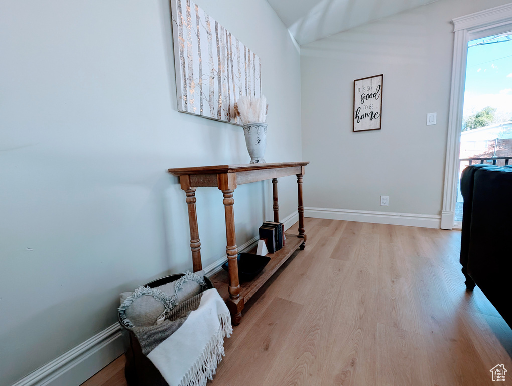 Hall featuring light wood-style floors and baseboards