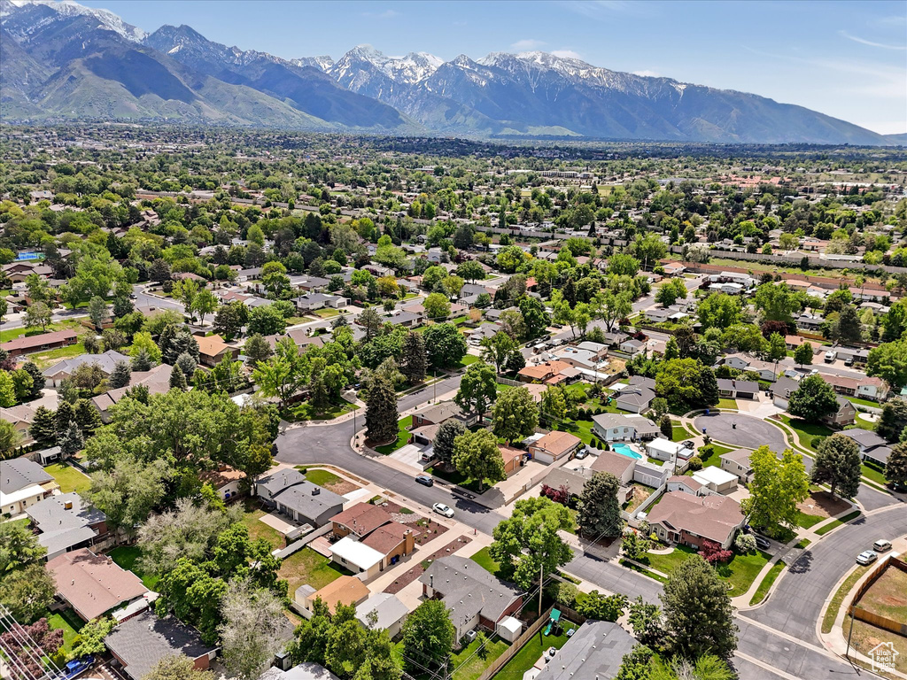 Aerial perspective of suburban area with a mountain backdrop