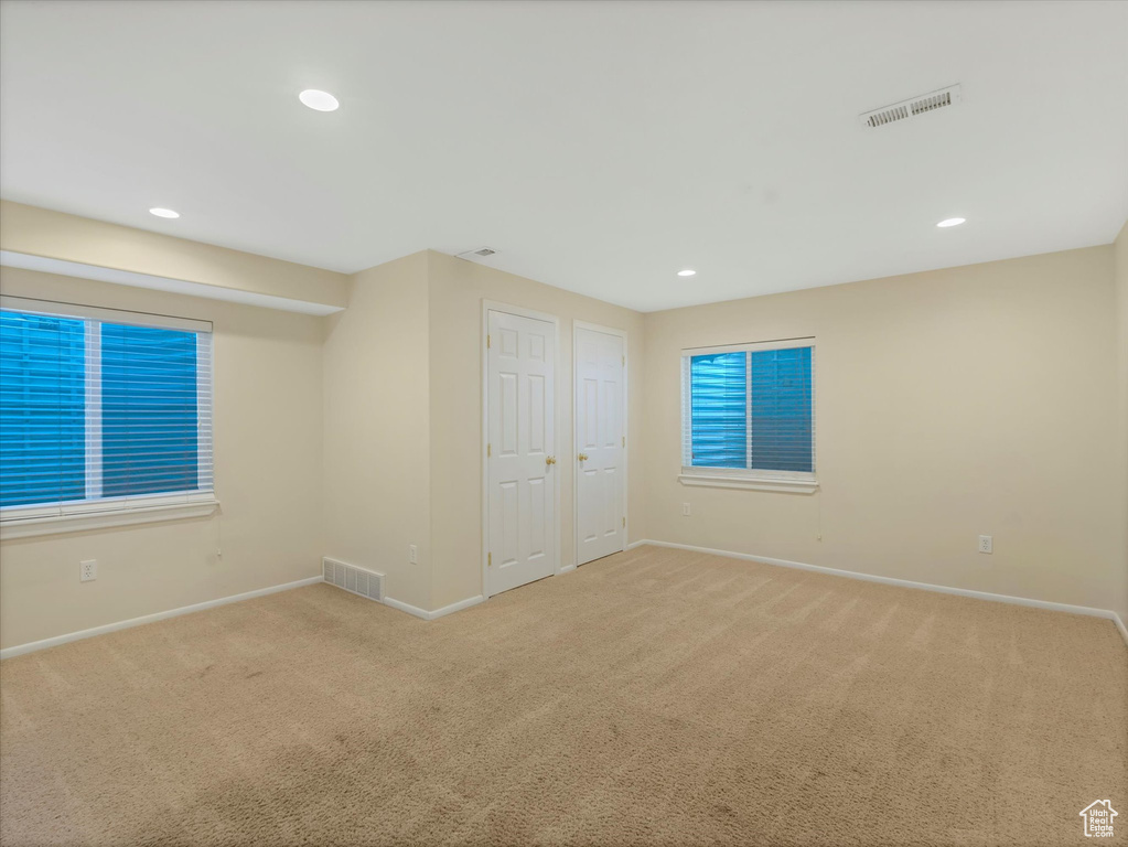 Unfurnished bedroom featuring baseboards, carpet flooring, and recessed lighting