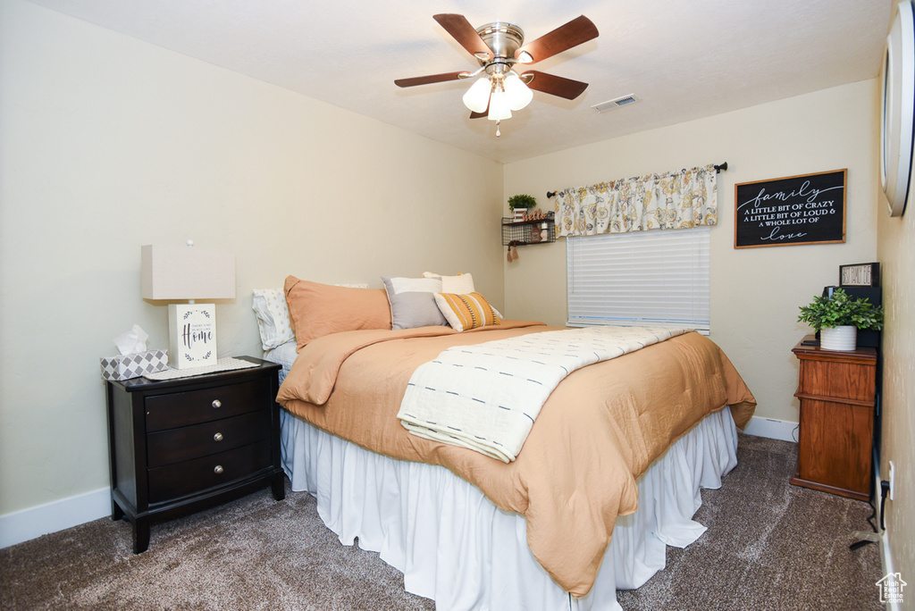 Bedroom featuring carpet, baseboards, and a ceiling fan
