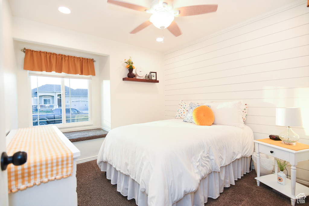 Bedroom featuring dark carpet, recessed lighting, and a ceiling fan