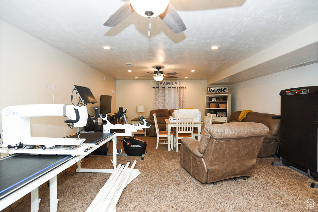 Interior space with ceiling fan and recessed lighting