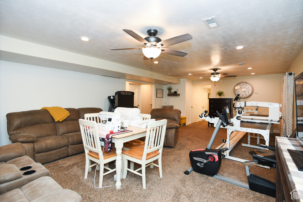 Dining space featuring ceiling fan, recessed lighting, and carpet flooring