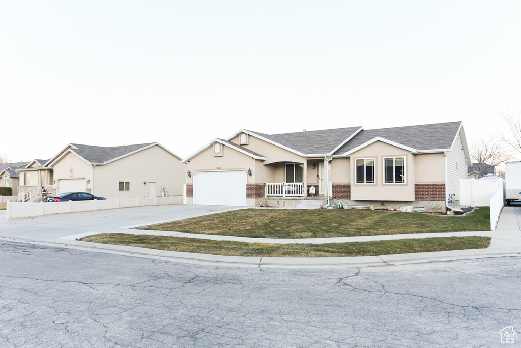 Ranch-style home with brick siding, driveway, a porch, a garage, and a shingled roof