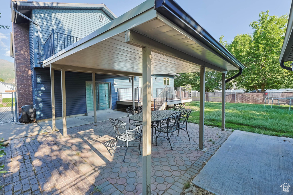 View of patio featuring outdoor dining space and a deck