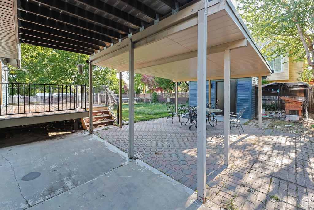 View of patio / terrace with outdoor dining area and a deck