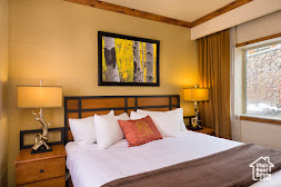 Bedroom featuring multiple windows