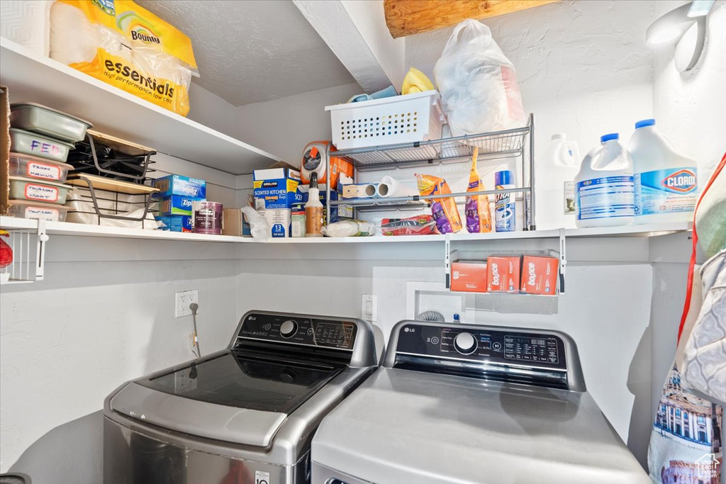 Laundry area featuring independent washer and dryer