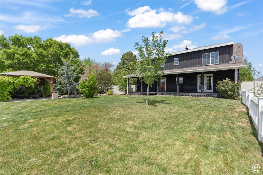 View of yard featuring a porch