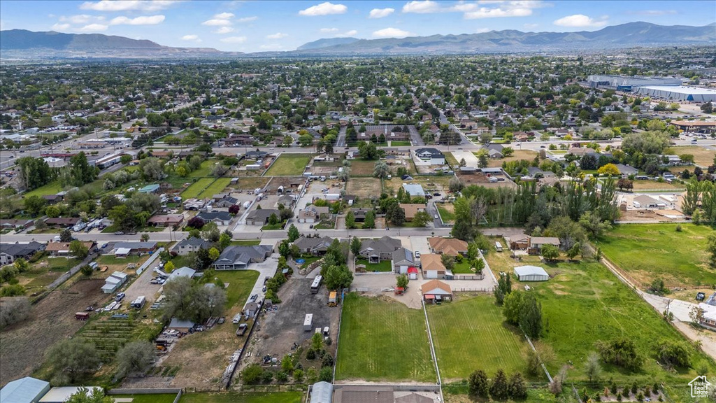 Aerial view of property\'s location with mountains and nearby suburban area